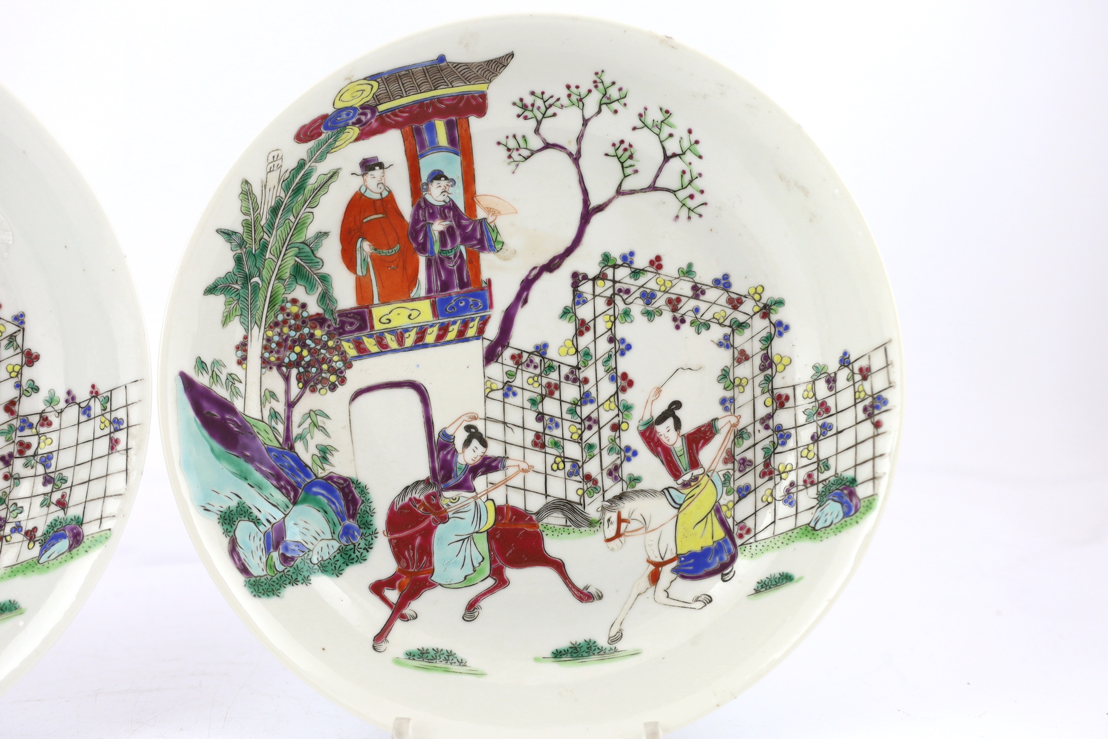 A pair of Chinese famille rose saucer dishes, Yongzheng mark but first half 19th century, one dish has a short hairline crack